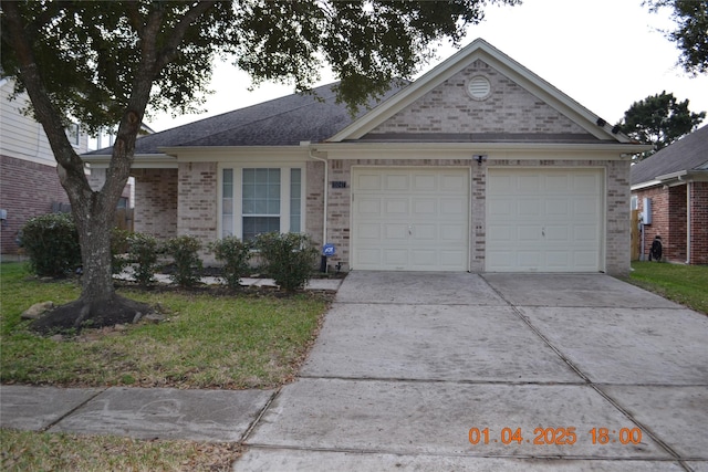 single story home featuring a garage and a front lawn