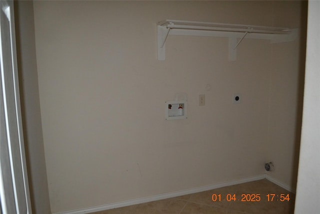 laundry area featuring tile patterned floors and washer hookup