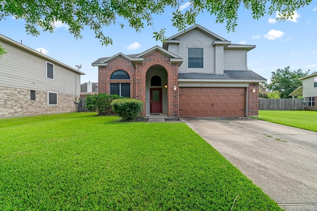 front facade featuring a front lawn and a garage