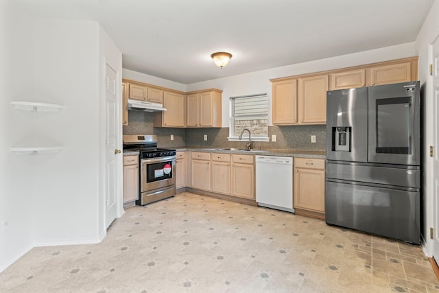 kitchen featuring backsplash, light brown cabinetry, sink, and appliances with stainless steel finishes