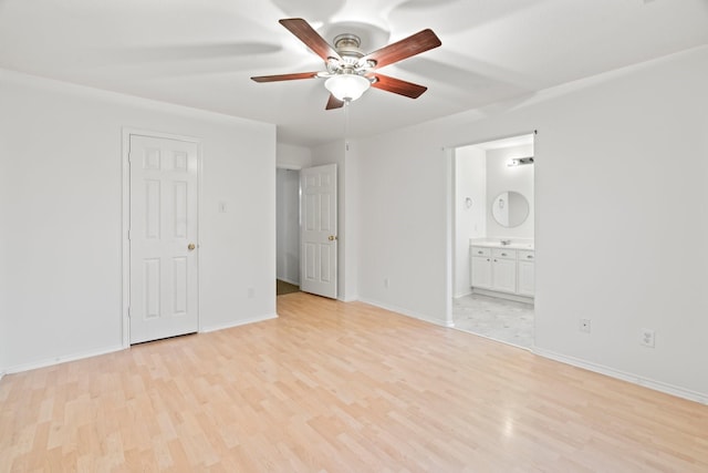 unfurnished bedroom featuring connected bathroom, ceiling fan, and light wood-type flooring