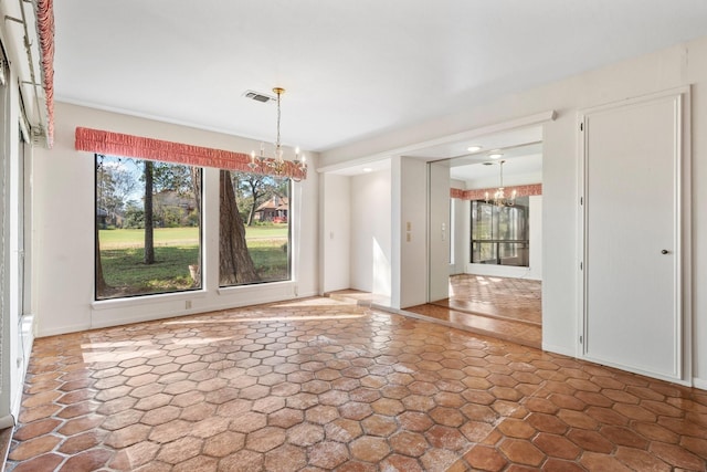 unfurnished dining area with an inviting chandelier