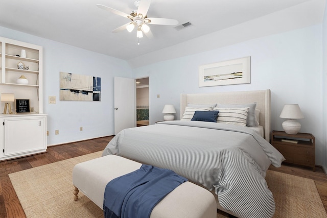 bedroom with ceiling fan and dark hardwood / wood-style flooring