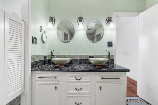 bathroom with tile patterned flooring and vanity