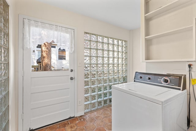 laundry room featuring tile patterned floors and washer / clothes dryer