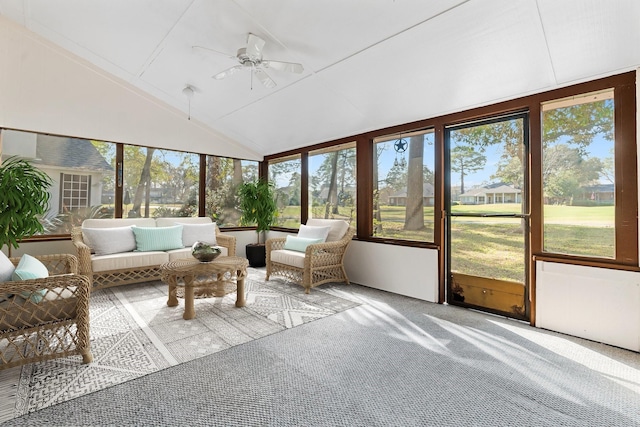 unfurnished sunroom with ceiling fan and lofted ceiling