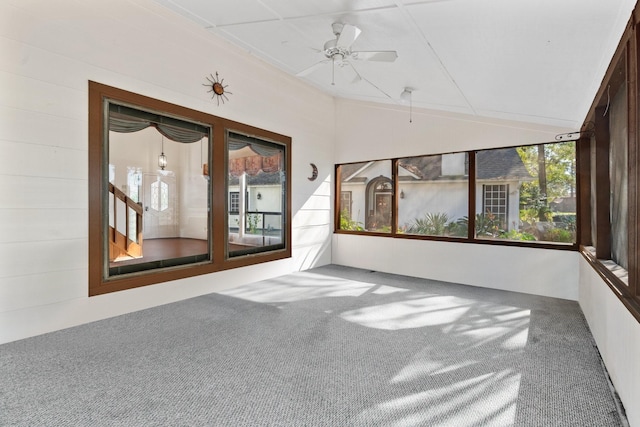 unfurnished sunroom with ceiling fan