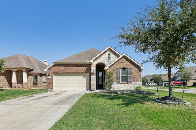 view of front facade with a garage and a front lawn