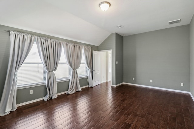 unfurnished room with lofted ceiling