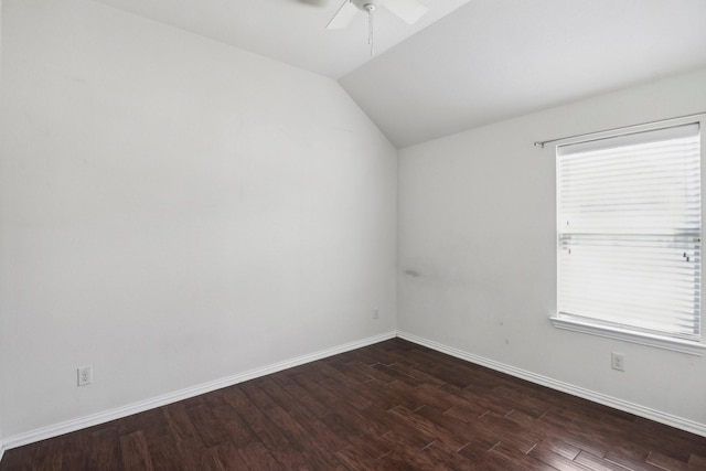 empty room with dark hardwood / wood-style floors, ceiling fan, plenty of natural light, and lofted ceiling