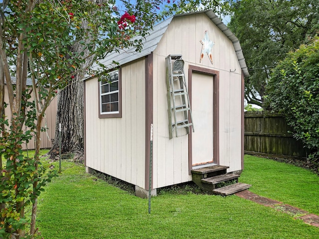 view of outdoor structure with a lawn