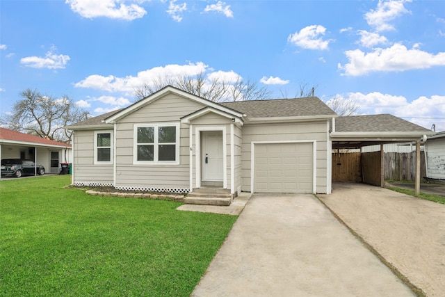 view of front of home with a carport, a front lawn, and a garage