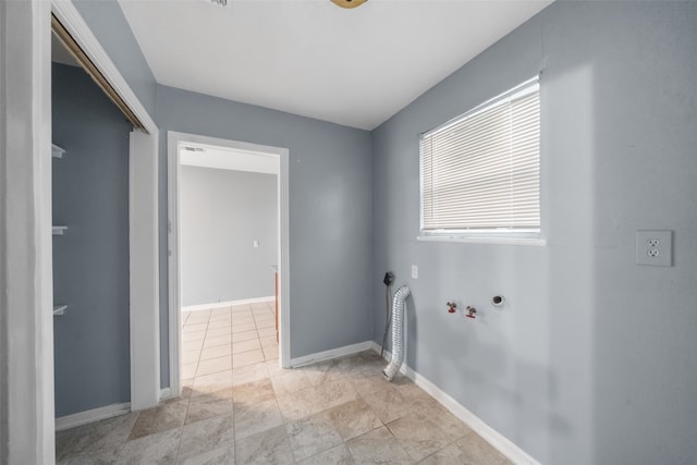 laundry area featuring washer hookup, plenty of natural light, hookup for a gas dryer, and hookup for an electric dryer