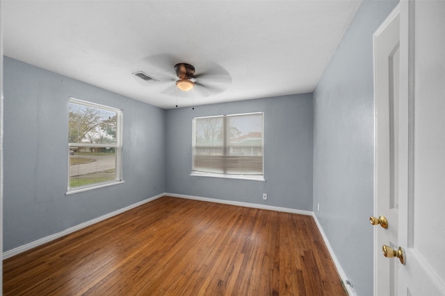 spare room featuring ceiling fan and hardwood / wood-style floors