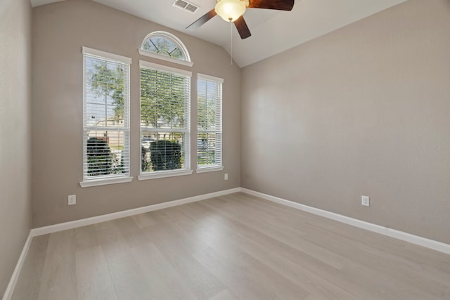 2206 Wolf Creek Ct, Katy, TX 77493 - unfurnished room with a ceiling fan, healthy amount of natural light, light wood-type flooring, lofted ceiling, and baseboards