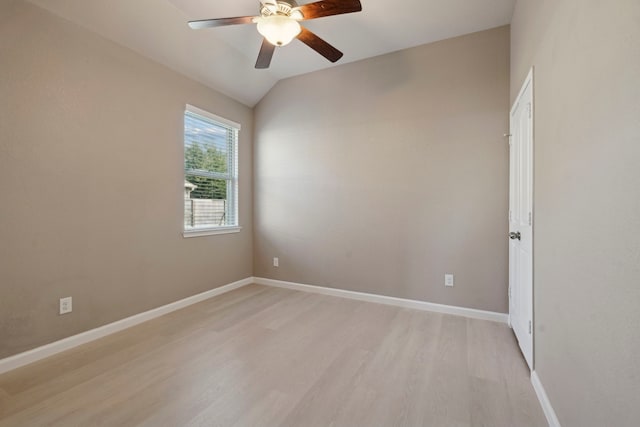 unfurnished room with ceiling fan, light hardwood / wood-style flooring, and lofted ceiling