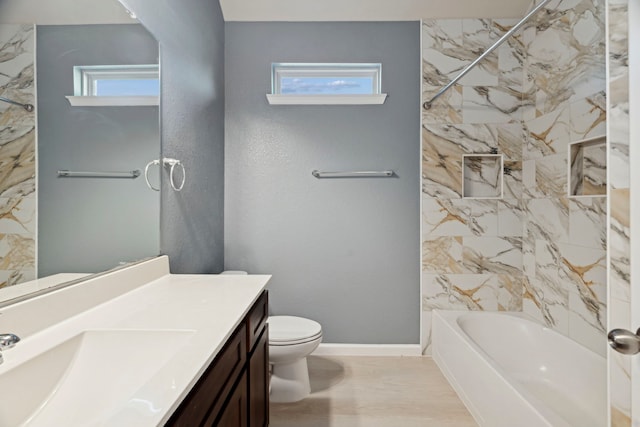 2206 Wolf Creek Ct, Katy, TX 77493 - bathroom with vanity, toilet, shower / tub combination, and baseboards