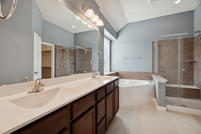 2206 Wolf Creek Ct, Katy, TX 77493 - full bath featuring a stall shower, a garden tub, double vanity, wood finished floors, and lofted ceiling