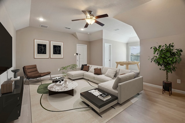 2206 Wolf Creek Ct, Katy, TX 77493 - living room featuring a ceiling fan, vaulted ceiling, baseboards, light wood-style flooring, and recessed lighting