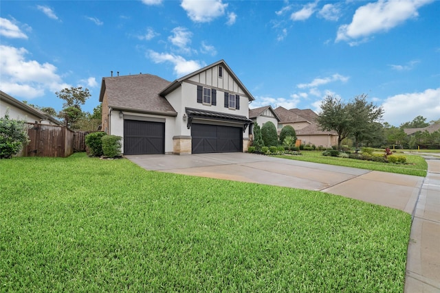 view of front facade with a garage and a front lawn