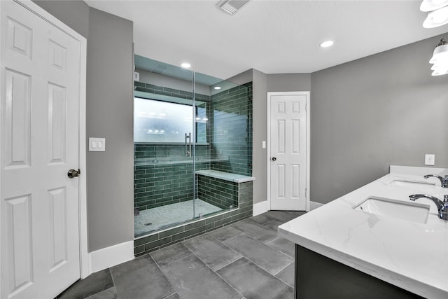 bathroom featuring vanity and a shower with shower door