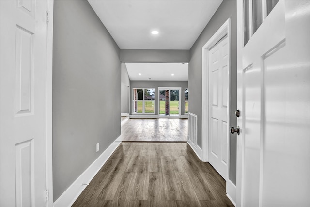 hallway featuring hardwood / wood-style flooring