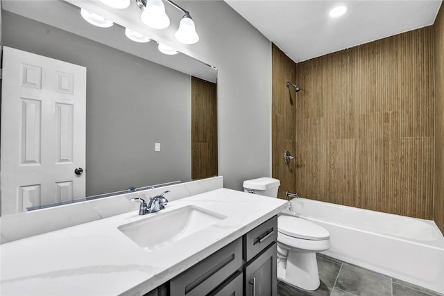 full bathroom featuring tile patterned flooring, vanity, toilet, and tub / shower combination