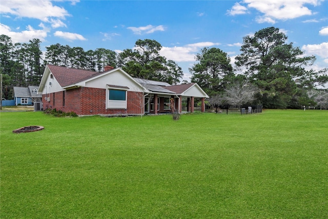 ranch-style home featuring a front lawn and central air condition unit