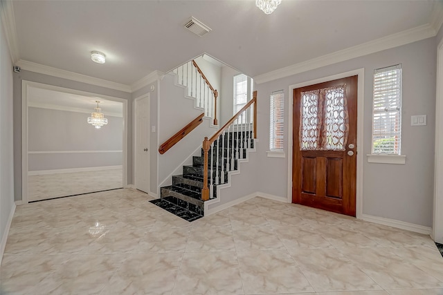 foyer featuring a chandelier and ornamental molding