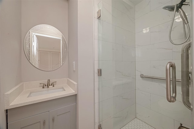 bathroom with vanity and a shower with shower door