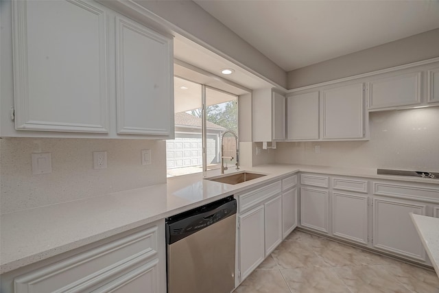 kitchen featuring backsplash, sink, stovetop, dishwasher, and white cabinetry