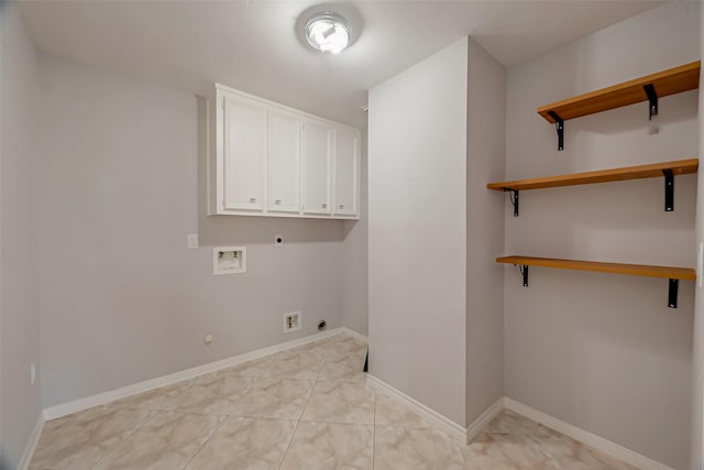 laundry area with gas dryer hookup, cabinets, washer hookup, and hookup for an electric dryer