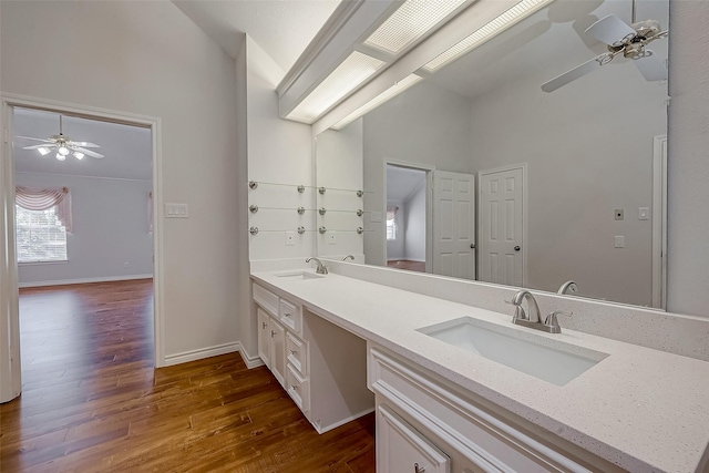 bathroom featuring hardwood / wood-style floors, vanity, and ceiling fan