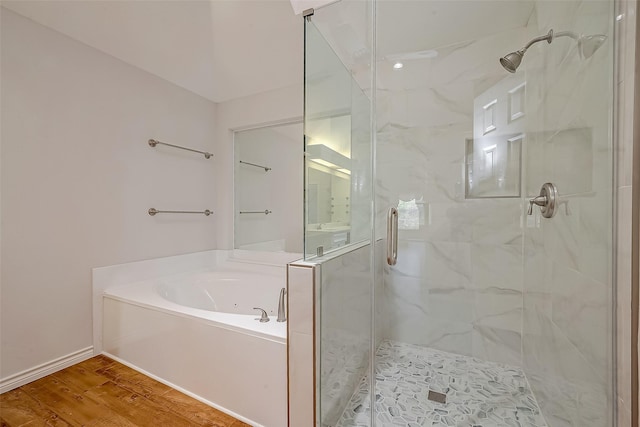 bathroom with hardwood / wood-style floors and plus walk in shower