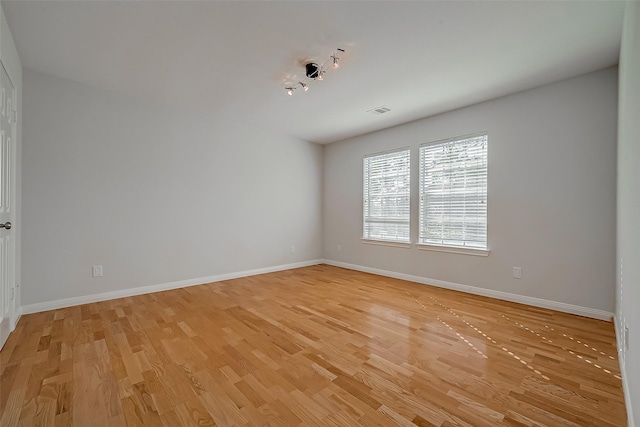 unfurnished room featuring light wood-type flooring