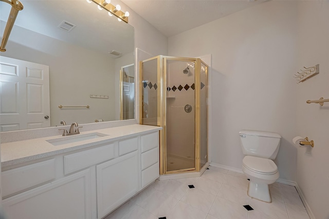 bathroom featuring toilet, a shower with door, vanity, and tile patterned flooring