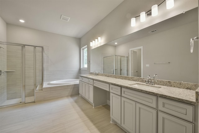 16146 Rustling Woods Rd, Conroe, TX 77302 - full bath featuring double vanity, a stall shower, and a garden tub