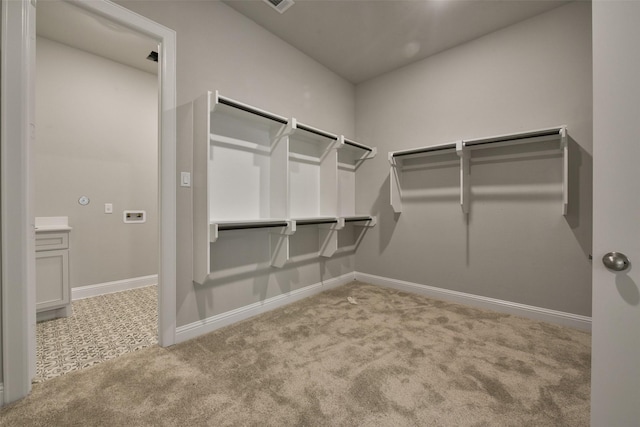16146 Rustling Woods Rd, Conroe, TX 77302 - walk in closet with carpet flooring