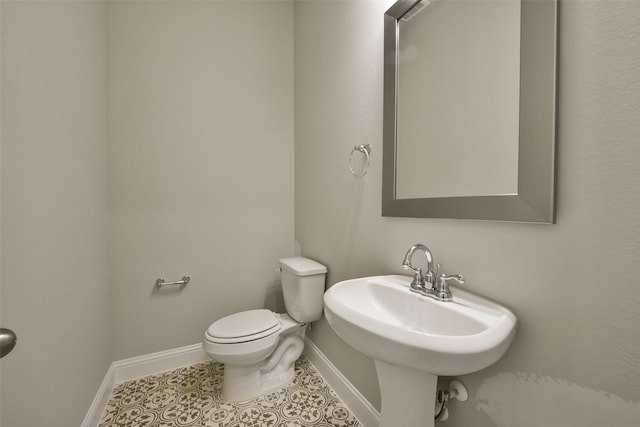 16146 Rustling Woods Rd, Conroe, TX 77302 - half bathroom featuring baseboards and tile patterned floors