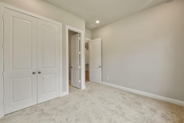 16146 Rustling Woods Rd, Conroe, TX 77302 - unfurnished bedroom featuring carpet, a closet, and recessed lighting