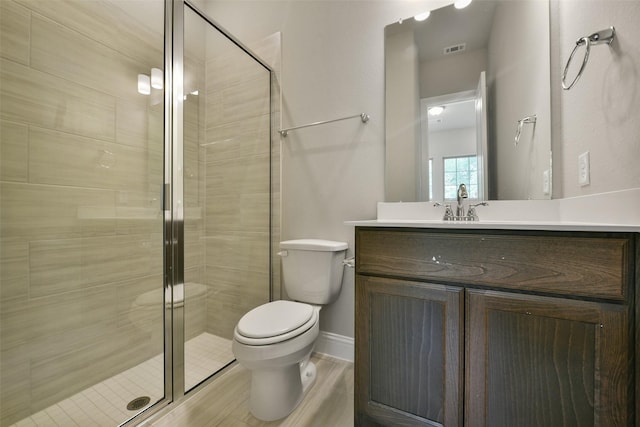 16146 Rustling Woods Rd, Conroe, TX 77302 - bathroom with vanity, a shower stall, and wood finished floors