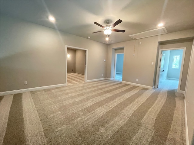 16146 Rustling Woods Rd, Conroe, TX 77302 - unfurnished room featuring attic access, a ceiling fan, and light colored carpet