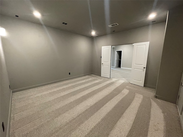 16146 Rustling Woods Rd, Conroe, TX 77302 - empty room with light colored carpet and baseboards