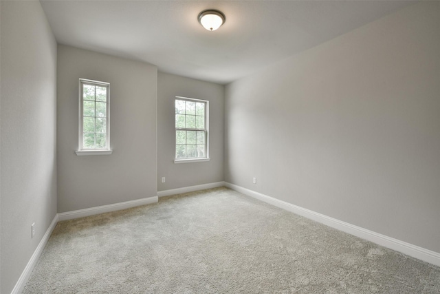 16146 Rustling Woods Rd, Conroe, TX 77302 - unfurnished room with light colored carpet and baseboards