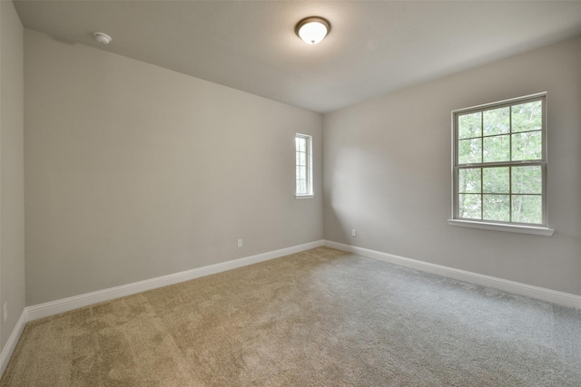 16146 Rustling Woods Rd, Conroe, TX 77302 - spare room featuring carpet and a smoke detector