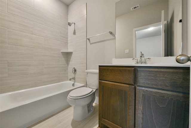 16146 Rustling Woods Rd, Conroe, TX 77302 - full bathroom featuring shower / tub combination, vanity, and wood finished floors