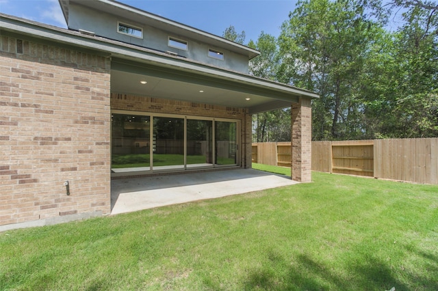 16146 Rustling Woods Rd, Conroe, TX 77302 - view of yard with a patio