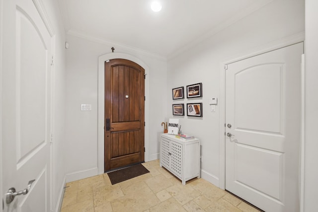 foyer featuring ornamental molding