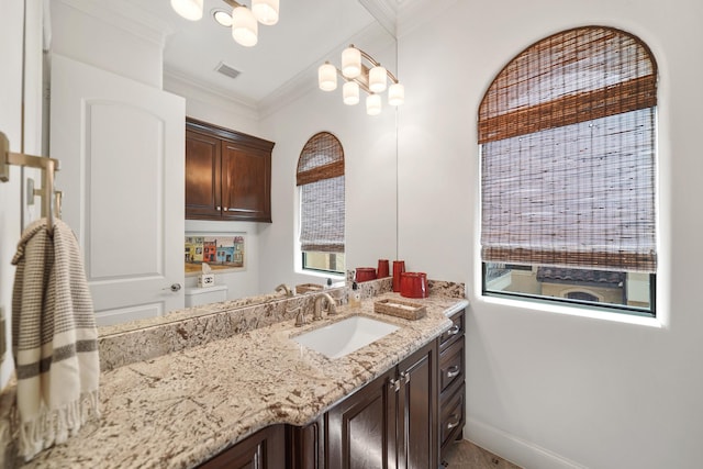 bathroom with vanity and crown molding