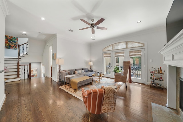 living room featuring ceiling fan, french doors, crown molding, and dark wood-type flooring